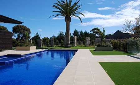 A paved pool and landscape garden in Mornington Peninsula, Victoria.