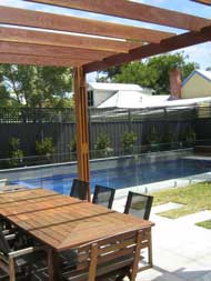 A paved outdoor entertaining area and pool in Sandringham, Victoria